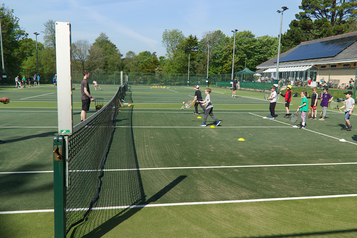 Keith running junior lesson in the sunshine